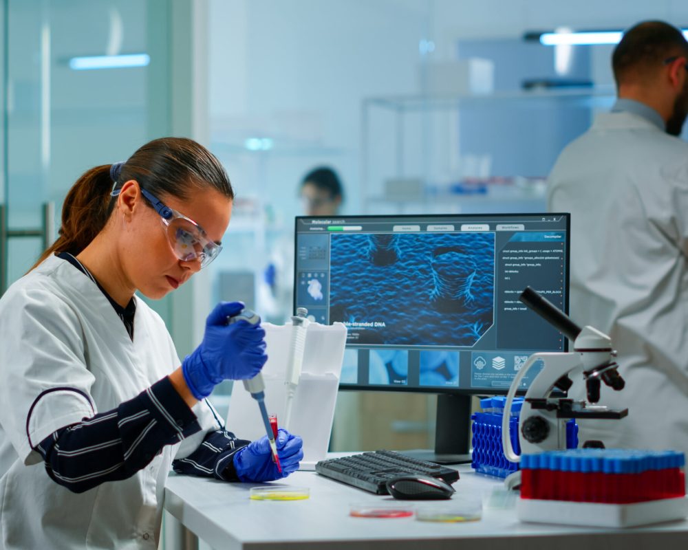 Scientist in modern equipped medical laboratory examinining drug discovery with micropipette. Medical stuff examining vaccine evolution using high tech and technology researching treatment, development against covid19 SSUCv3H4sIAAAAAAAACoyVy47cNhBF9wHyDwOuQ4RvUvkCb7zyMsiCL3ULlsSGxHZsDObfU3o21aOxgwEao6qrYulU6er1999eXpCzY+PRXy+v0xVcN217H/Ngc5N6CJM/1vgQ+xCHMvJt4IqUgRianIbGtmXQ2eyvve0iBPt7207htzmJxmzzfYxjcXrX+CGNOfmvN2gDEnSr00H4dk05HaI2JBdnPUSZ3sJhiLYbczOf+ghTxof6EHHNZTltqgwZviV8atN9cOn74bTWdj8O999SH+QhMl7vOcfhfU+35nu2xy7jLY3N46kemS5N+GMbu9jnsewr/oixm3oqOHqb4wXAH0huc/17uX7ZEsvT2Qwp9MU3sfcRrcWX/u9uSn1uRh/b1vYxwRy2/HLgB9U+Rdvmq7dD/PMzrIKHPfj/hZd//tlJX6CxCfXrW/GgAxCxy8Ksj4UCJ9qSqDGJocbCMYaNYRwz7UM00hPF1NYGkrVwioqAvawlFtIZbA38RBsIV76qvBS7WAUhNa0MZt5yLAgj2FQ6YMs1ZcExS0O9ix2TOtbUY8+IxYLGiCtqCdzLDWfS1jT4XSyCp4E6hnWIUJnqGjvLasycYsxWkdR1nMksONDXf2Ghunm4Kwh7D00qhv0tAe15Twpat6HxTX8pbkv5Or/C220+3fs8TJjR3lyb0s26dnpxaqgZt/jVjiPIwxYv9w8MI3XFOX3K85DWqijAgk6XlDMFoCURgouKCG1Q6QTXBurM7WwN3m9tsiFOh+4Ld+IRMFMtmWGb6byzi1nAlVIPwcE5FoGQtKhw8JAzweYmZ7lnXznTHCzmJL+5zZpTfPOhwnfOck8OdHr76kVnuWdXWjSamc2DzvxpFhkuREF4typFpYJ3iZsltZnI5AhdA60ex3syGHgP5UfcpeHyV9yPmpPBHgVHuLKS6iNyx9wpOSWY5j8fjhFUVedzN0ISZn4BHkRM6RXu4fsKhzSh/Coc4CKwHq3B2B6mt7EFSPaSRg8kgBajhBNCxUP3zBlKES0qzfguOWBGjMJfRSq5528rZURFpYSC8o/UChlpTmFvOHsUfUKMhBTCUK4ekifCiFbMwBhgf3fJRhjVFoYjuMV10GDbIljsmCNYeO1NXVj2O+6IKg7oobUCeDNtMjLcxFi5ClMF3yVRC4qdrgPWLDoH35KqIjXc9fYfAAAA//8DAPySF5iACQAA